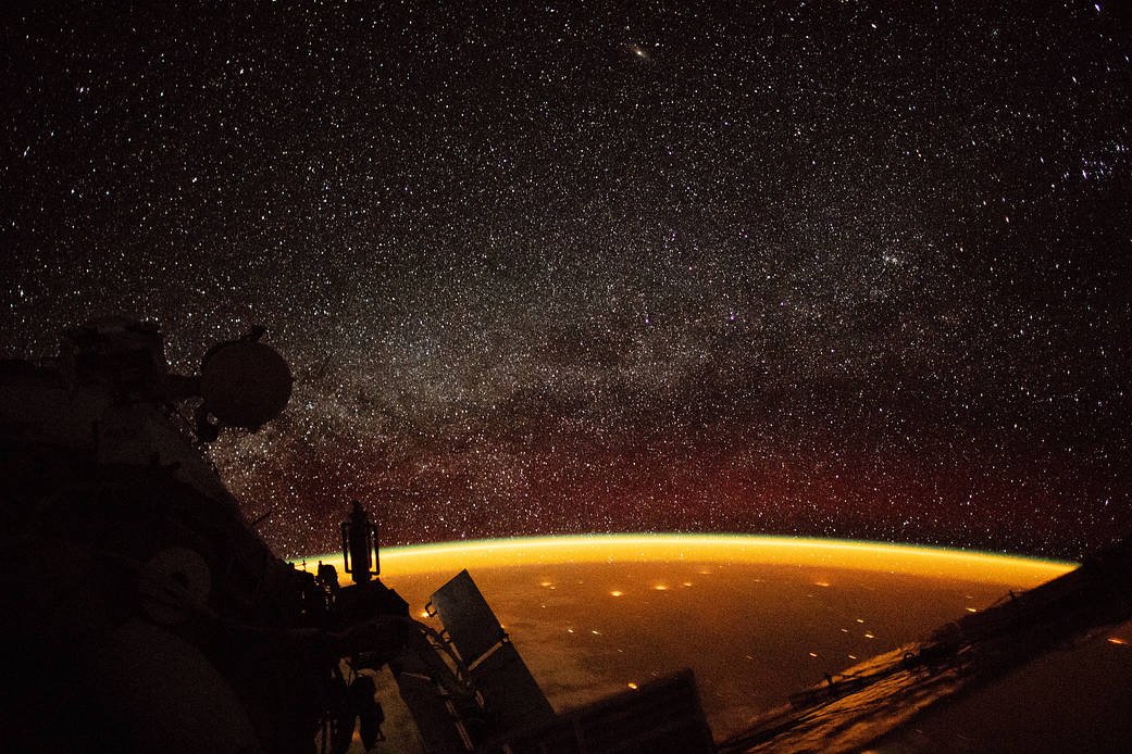 Orange atmospheric airglow above Earth photographed from the International Space Station.